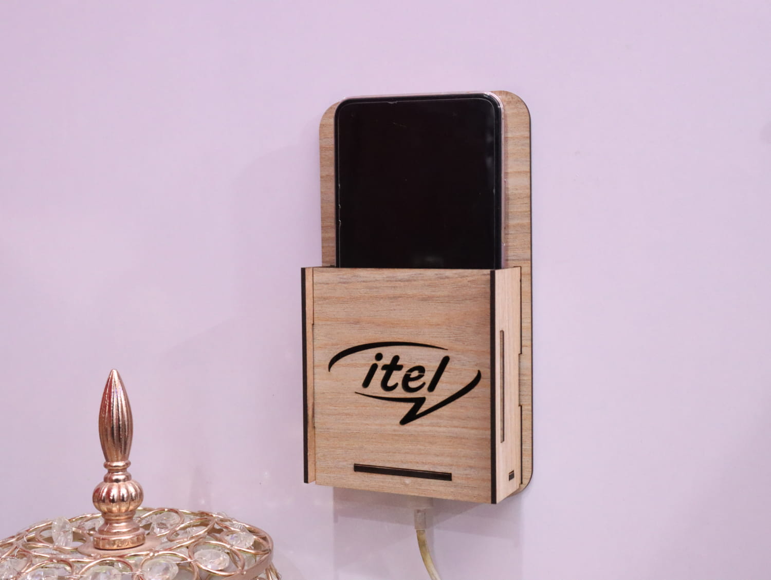 Laser Cut Wall Mounted Mobile Holder With Itel Logo Free Vector
