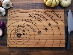 Laser Cut Planets Vector Art on Cutting Board Free Vector